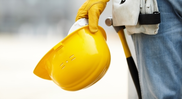 person holding construction hat