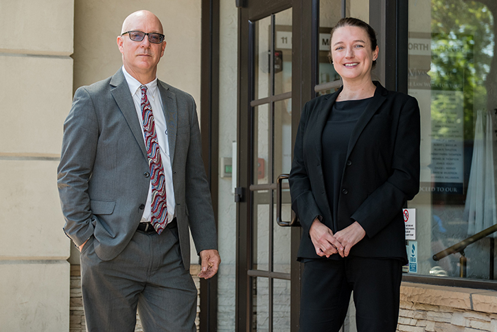 two attorneys sitting in the park